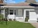 Front view of a single-story house with a garage and landscaping at 9395 Sw 97Th Ln # B, Ocala, FL 34481