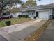 Exterior view showing a house with a driveway and landscaping at 9395 Sw 97Th Ln # B, Ocala, FL 34481