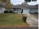 Front view of a single-story house with a garage and driveway at 9395 Sw 97Th Ln # B, Ocala, FL 34481