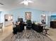 Living room features a large TV and a work area at 9395 Sw 97Th Ln # B, Ocala, FL 34481