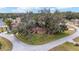 House nestled on a lot with mature trees in a residential neighborhood at 10090 Sw 78Th Ct, Ocala, FL 34476