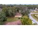 House view from above, showing backyard, trees, and neighborhood roads at 10090 Sw 78Th Ct, Ocala, FL 34476