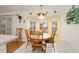 Cozy breakfast nook with wood table and bay window at 10090 Sw 78Th Ct, Ocala, FL 34476