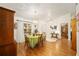 Charming dining room featuring hardwood floors and a green tablecloth at 10090 Sw 78Th Ct, Ocala, FL 34476