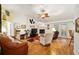 Comfortable living room with fireplace and hardwood floors at 10090 Sw 78Th Ct, Ocala, FL 34476