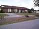 Brick community hall with a covered entryway at 10470 Sw 99Th Ave, Ocala, FL 34481