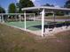 Two shuffleboard courts with covered seating areas at 10470 Sw 99Th Ave, Ocala, FL 34481