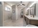 Spa-like bathroom with double sinks, large shower, and linen closet at 1105 Se 48Th Ave, Ocala, FL 34471