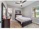 Cozy bedroom with ceiling fan and neutral color scheme at 1105 Se 48Th Ave, Ocala, FL 34471