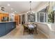 Bright kitchen dining area with a round table and chairs near a window at 1105 Se 48Th Ave, Ocala, FL 34471