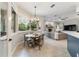 Kitchen breakfast nook with a round table and chairs, overlooking the backyard at 1105 Se 48Th Ave, Ocala, FL 34471