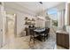 Bright dining room featuring a large table and chandelier at 1105 Se 48Th Ave, Ocala, FL 34471