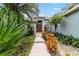 Inviting house entrance with lush landscaping and brick walkway at 1105 Se 48Th Ave, Ocala, FL 34471