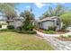 Single-story home with stone accents and landscaping at 1105 Se 48Th Ave, Ocala, FL 34471