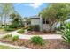 Single story home with walkway, landscaping, and stone accents at 1105 Se 48Th Ave, Ocala, FL 34471