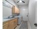 Functional laundry room with washer, dryer, and cabinets at 1105 Se 48Th Ave, Ocala, FL 34471