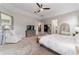 Bright and airy main bedroom with a king-size bed and access to the bathroom at 1105 Se 48Th Ave, Ocala, FL 34471