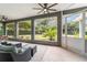 Relaxing screened porch with seating and backyard views at 1105 Se 48Th Ave, Ocala, FL 34471