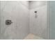 Large walk-in shower with marble tile and modern fixtures at 1105 Se 48Th Ave, Ocala, FL 34471