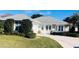 One-story home with gray roof and landscaped yard at 11441 Sw 68Th Ct, Ocala, FL 34476