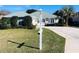 House exterior showcasing a well-maintained lawn and driveway at 11441 Sw 68Th Ct, Ocala, FL 34476