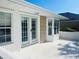 Exterior view of back patio with french doors at 11441 Sw 68Th Ct, Ocala, FL 34476