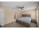 Spacious bedroom with wood bed frame and ceiling fan at 13076 Sw 38Th Ter, Ocala, FL 34473