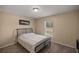 Cozy bedroom with a full-size bed and window at 13076 Sw 38Th Ter, Ocala, FL 34473