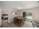 Dining area with square table and chairs, near bedroom and kitchen at 13076 Sw 38Th Ter, Ocala, FL 34473