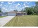 Newly constructed home with a large yard and attached garage at 13076 Sw 38Th Ter, Ocala, FL 34473