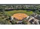 Aerial view of community baseball field and surrounding park at 13309 Se 92Nd Court Rd, Summerfield, FL 34491