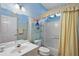 Small bathroom with tub shower and updated fixtures at 13309 Se 92Nd Court Rd, Summerfield, FL 34491