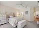 Bright bedroom with a ceiling fan, carpeted floor, and white dresser at 13309 Se 92Nd Court Rd, Summerfield, FL 34491