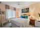 Guest bedroom with a ceiling fan and large window at 13309 Se 92Nd Court Rd, Summerfield, FL 34491