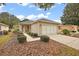 Cute one-story home with attached garage and manicured landscaping at 13309 Se 92Nd Court Rd, Summerfield, FL 34491