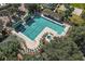 Community pool with lounge chairs and spa at 13309 Se 92Nd Court Rd, Summerfield, FL 34491