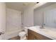 Modern bathroom with a white bathtub and wood vanity at 15551 Sw 150Th Pl, Ocala, FL 34481