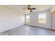 Bedroom with two windows, ceiling fan, and closet at 15551 Sw 150Th Pl, Ocala, FL 34481