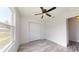 Bright bedroom with ceiling fan and window at 15551 Sw 150Th Pl, Ocala, FL 34481