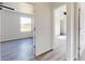 Bright hallway with doors to bedrooms and flooring at 15551 Sw 150Th Pl, Ocala, FL 34481