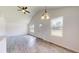 Spacious living room featuring wood-look floors and vaulted ceiling at 15551 Sw 150Th Pl, Ocala, FL 34481