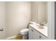 Small bathroom with white vanity, toilet, and mirror at 1903 Se 37Th Court Cir, Ocala, FL 34471