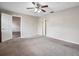 Spacious bedroom with carpet and ceiling fan at 1903 Se 37Th Court Cir, Ocala, FL 34471