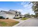 Townhome community view with houses and a tree-lined street at 1903 Se 37Th Court Cir, Ocala, FL 34471