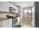 Kitchen with white cabinets, granite countertops, and stainless steel appliances at 1903 Se 37Th Court Cir, Ocala, FL 34471