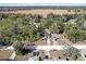 Aerial view showing house, yard, and surrounding neighborhood at 19173 St Benedict Dr, Dunnellon, FL 34432