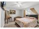 Bedroom with a floral patterned bedspread and TV at 19173 St Benedict Dr, Dunnellon, FL 34432