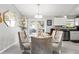 Dining room with glass table and six chairs at 19173 St Benedict Dr, Dunnellon, FL 34432