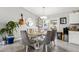 Dining room with glass table and six chairs at 19173 St Benedict Dr, Dunnellon, FL 34432