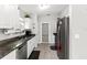 Kitchen with granite countertops, white cabinets, and stainless steel appliances at 19173 St Benedict Dr, Dunnellon, FL 34432